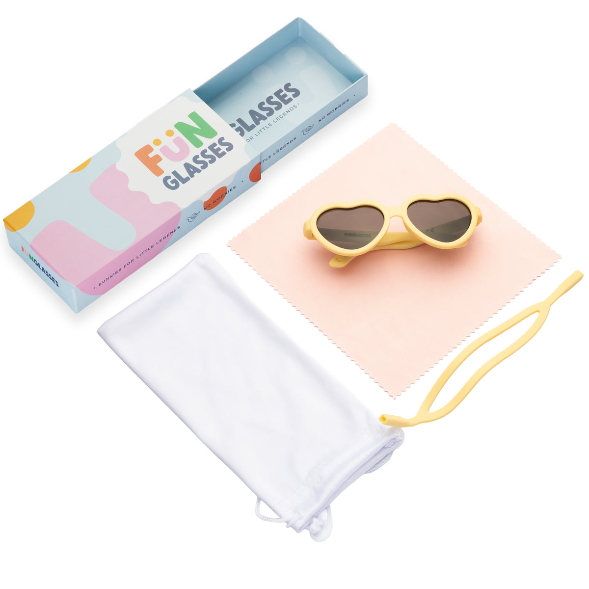 Heart-shaped sunglasses with yellow frame and dark lenses on a pink cloth, next to a blue box labeled 'Fun Glasses' on a white background.